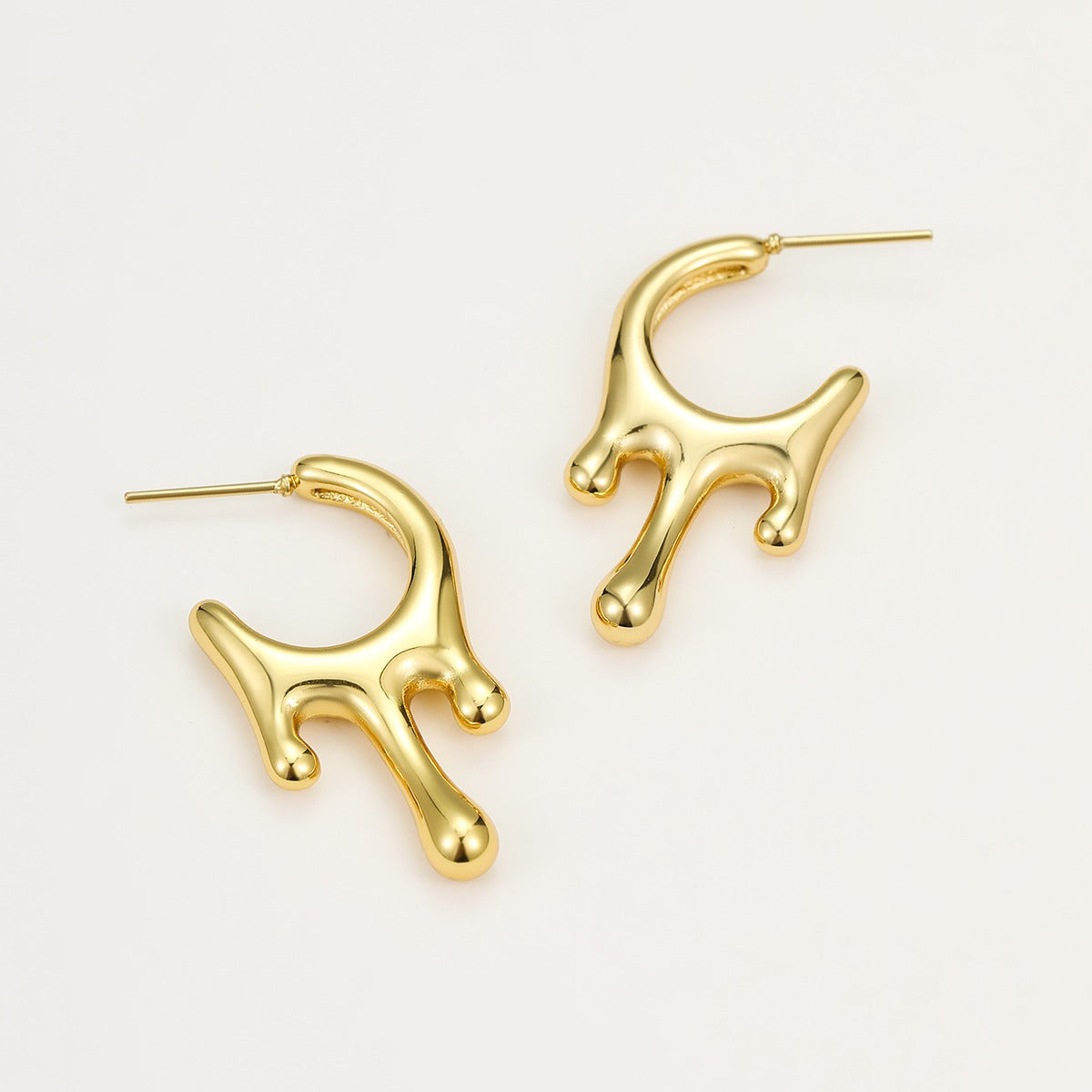 Lumora Golden Fluid Drip Earrings