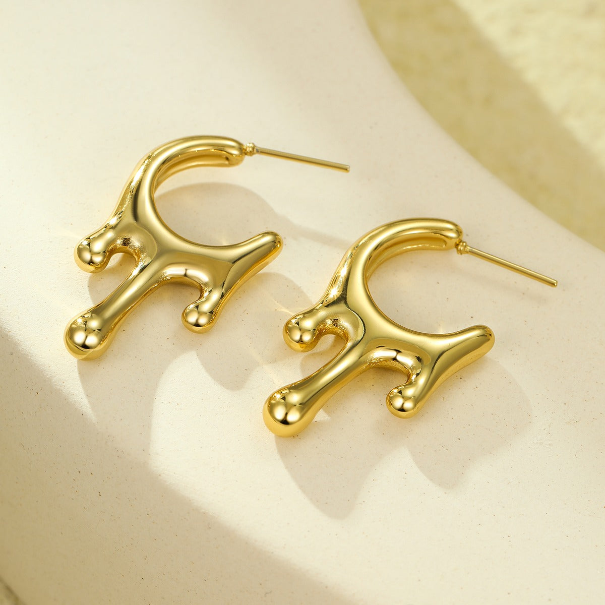 Lumora Golden Fluid Drip Earrings