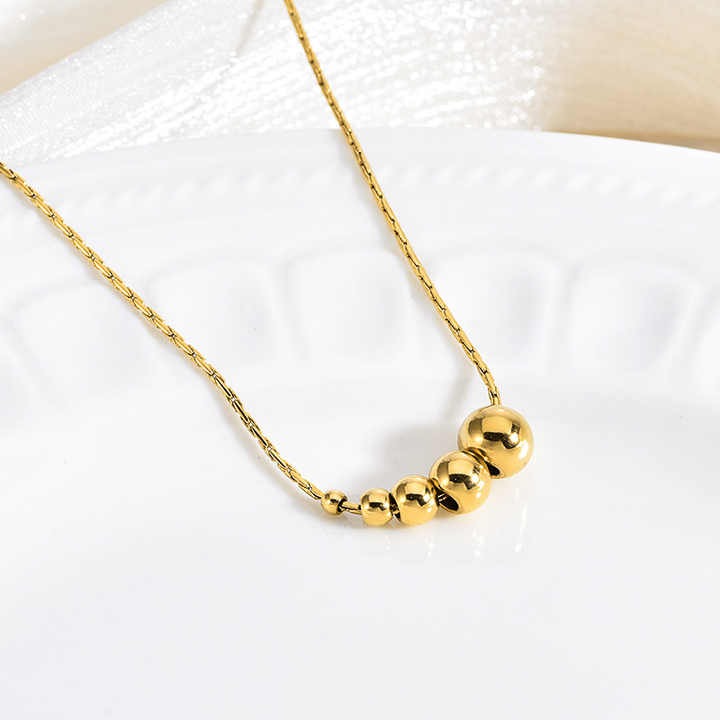 Lumora Golden Bead Cascade Necklace – Modern Minimal Luxe