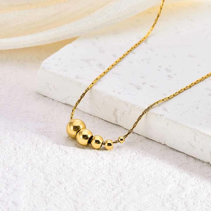 Lumora Golden Bead Cascade Necklace – Modern Minimal Luxe