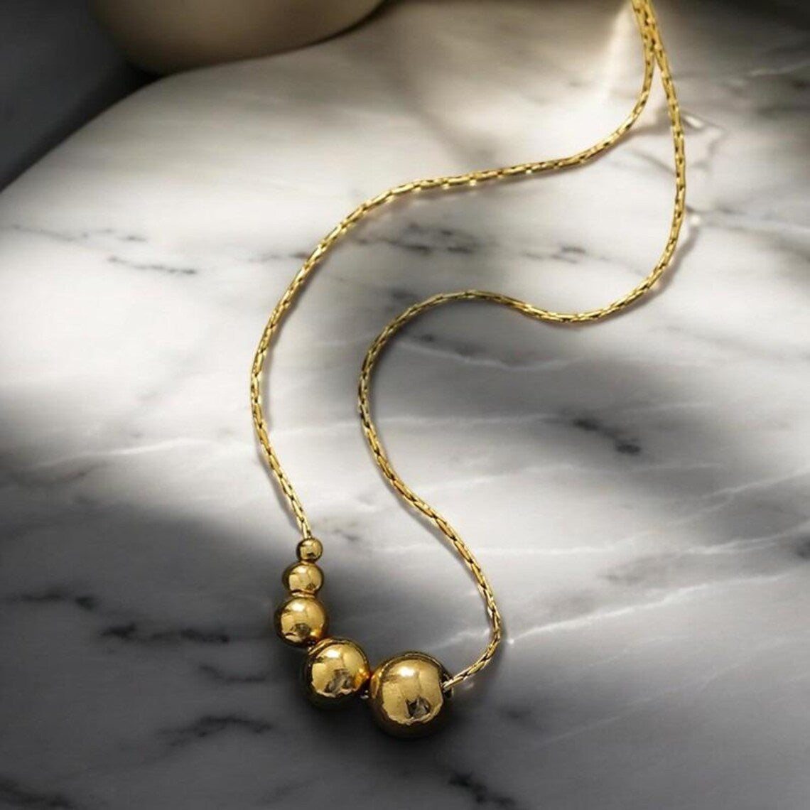 Lumora Golden Bead Cascade Necklace – Modern Minimal Luxe
